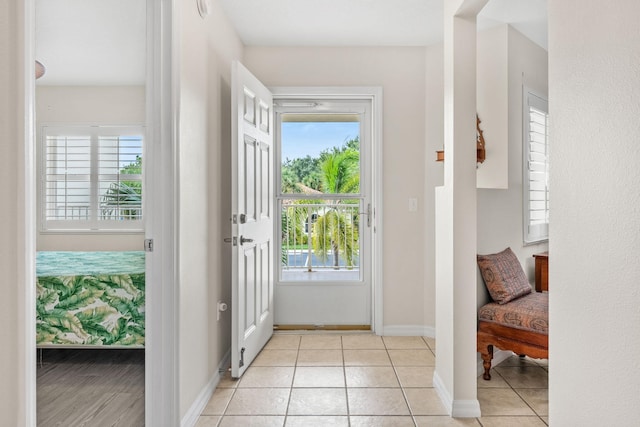 doorway featuring light tile patterned floors