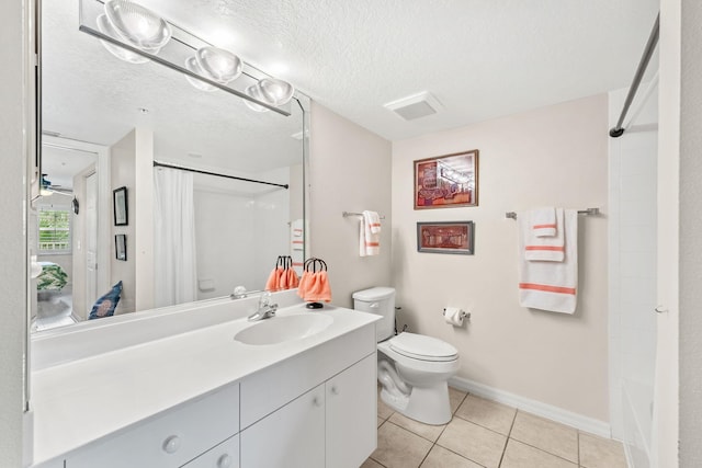 full bathroom with tile patterned flooring, vanity, toilet, and a textured ceiling