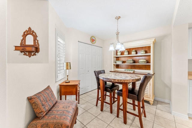 dining area with light tile patterned floors