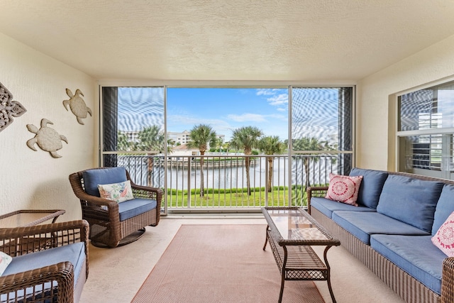 sunroom / solarium with a water view