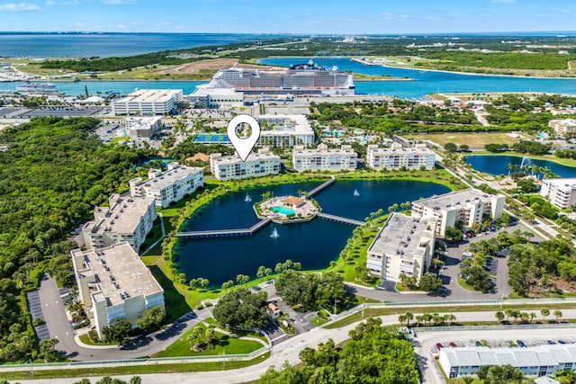 birds eye view of property with a water view