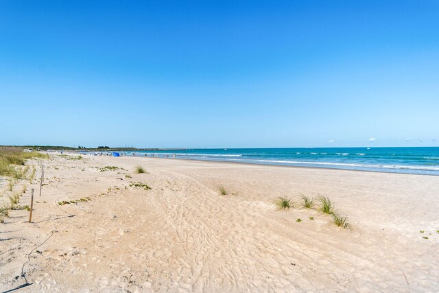 property view of water featuring a beach view