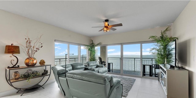 living room with ceiling fan and light tile patterned floors