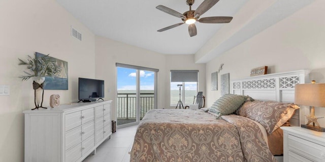 bedroom with ceiling fan, light tile patterned flooring, and access to exterior