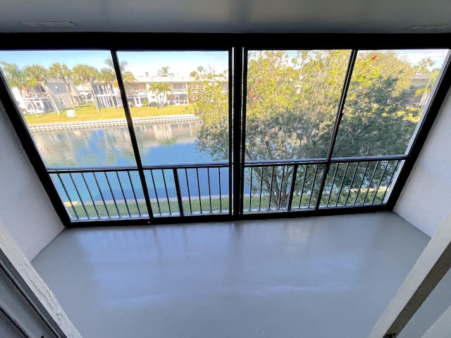 interior space featuring a water view and plenty of natural light