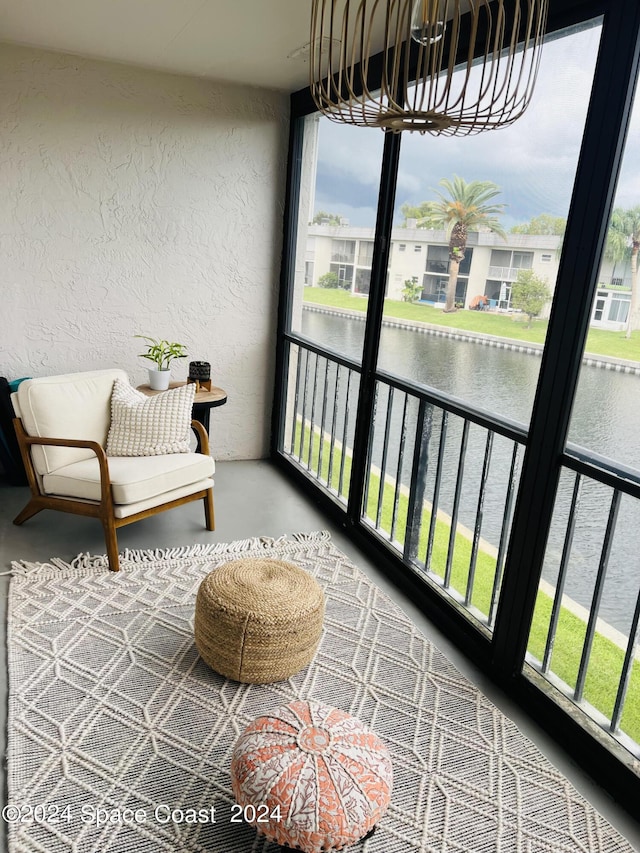 balcony featuring a water view