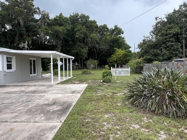 view of yard with a carport