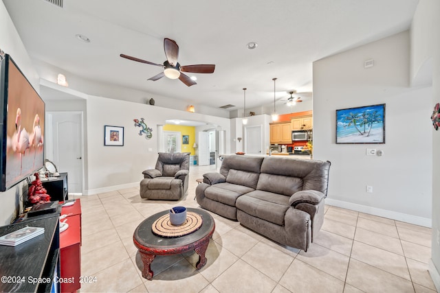 tiled living room featuring ceiling fan