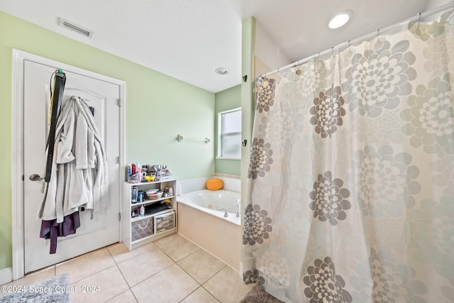 bathroom featuring plus walk in shower and tile patterned flooring