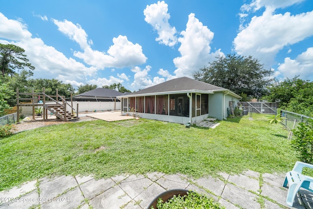 view of yard featuring a sunroom