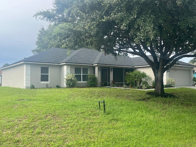 ranch-style home with a front lawn and a garage