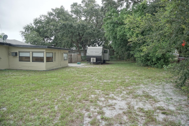 view of yard featuring a wall unit AC