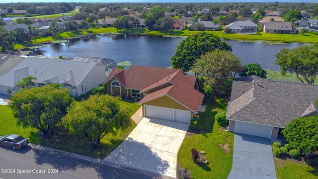 bird's eye view with a water view and a residential view