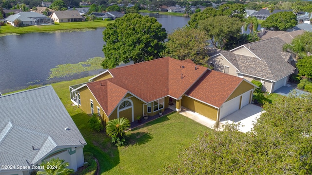 birds eye view of property with a water view