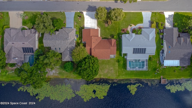 birds eye view of property featuring a water view