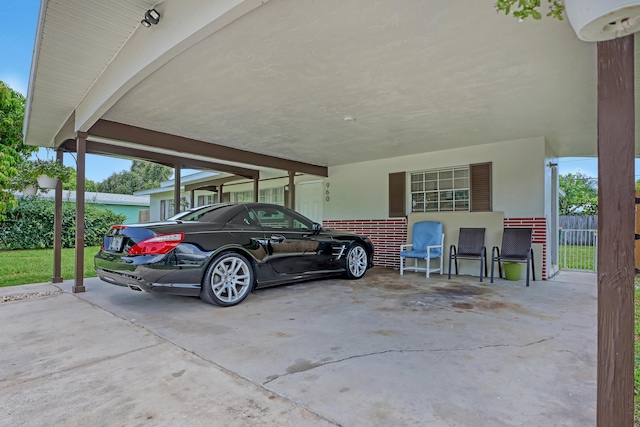 exterior space with a carport