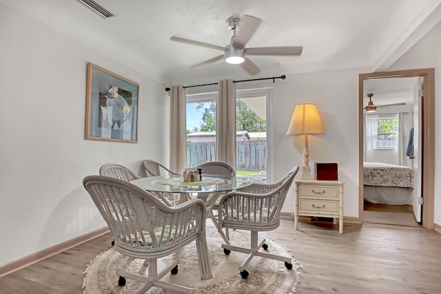 office space with ceiling fan and light hardwood / wood-style floors