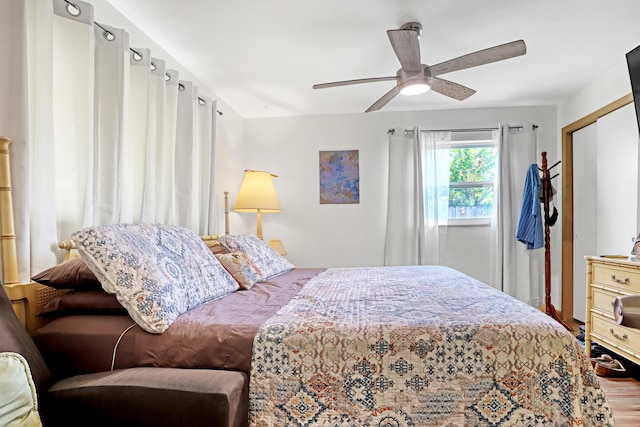 bedroom featuring hardwood / wood-style flooring, a closet, and ceiling fan