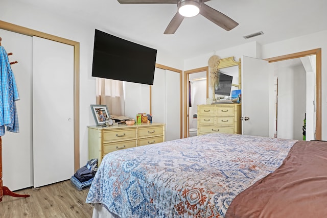 bedroom with ceiling fan and light wood-type flooring