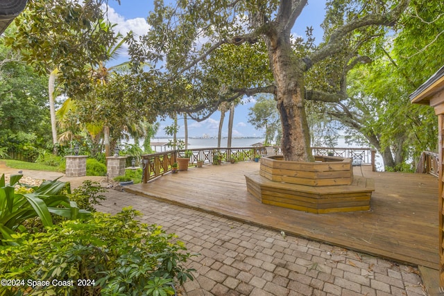 wooden terrace with a water view