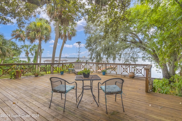 wooden deck with a water view