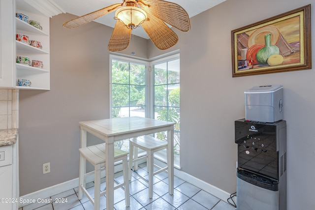 dining room featuring ceiling fan and light tile patterned floors