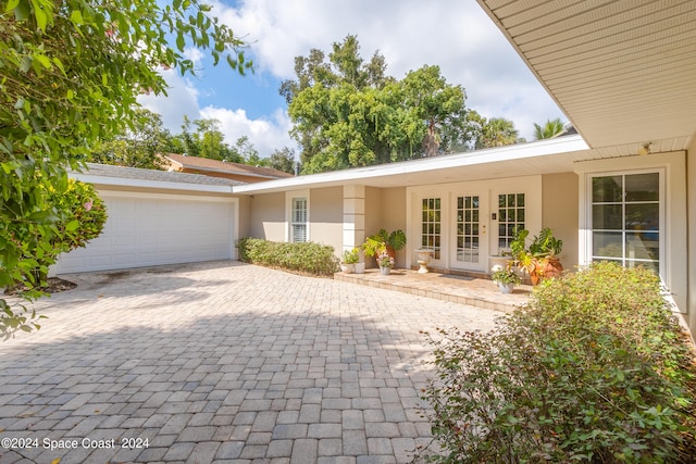 view of front of house featuring french doors and a garage