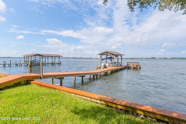 dock area with a water view