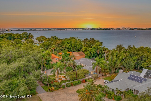 aerial view at dusk with a water view