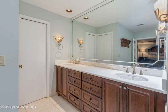 bathroom featuring vanity and tile patterned flooring