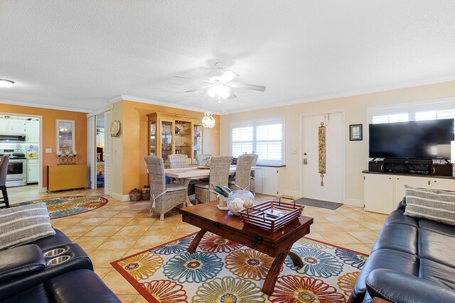 tiled living room with ceiling fan, ornamental molding, and a textured ceiling