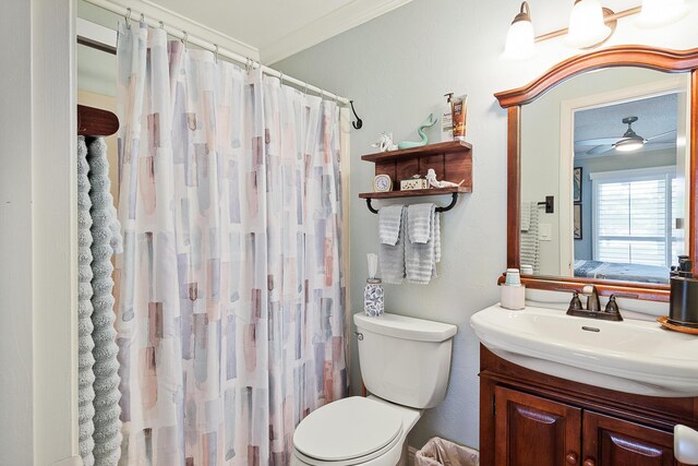 bathroom featuring crown molding, ceiling fan, vanity, curtained shower, and toilet