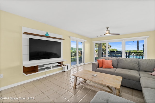 tiled living room with ceiling fan