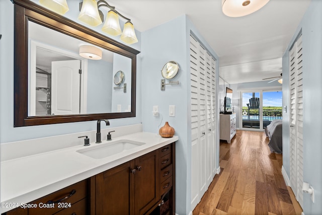 bathroom featuring vanity, ceiling fan, and hardwood / wood-style floors