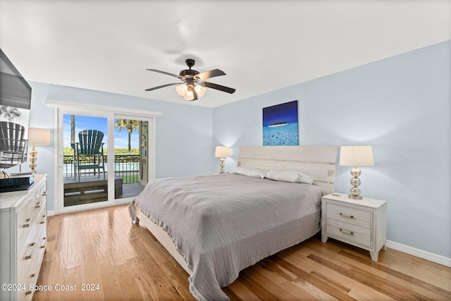 bedroom featuring ceiling fan, light hardwood / wood-style flooring, and access to outside