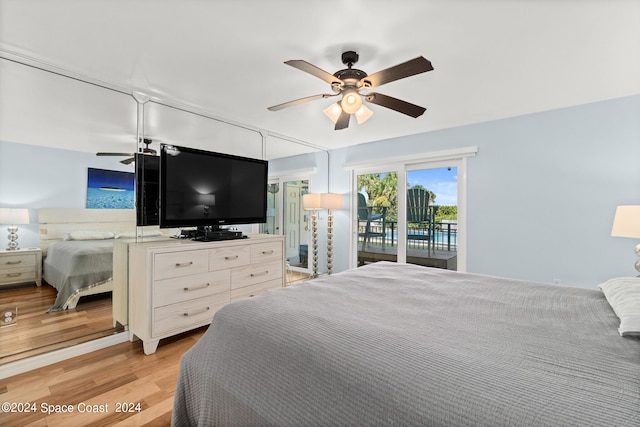 bedroom featuring ceiling fan, light hardwood / wood-style flooring, and access to exterior