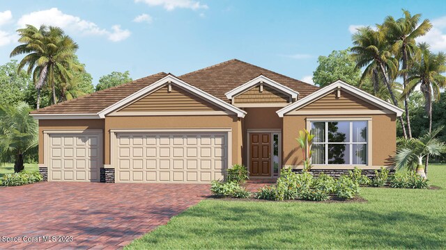 view of front of house with a front yard and a garage