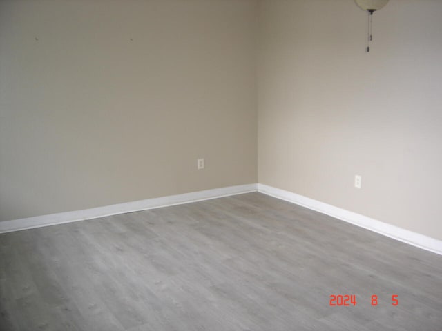 unfurnished room featuring hardwood / wood-style floors