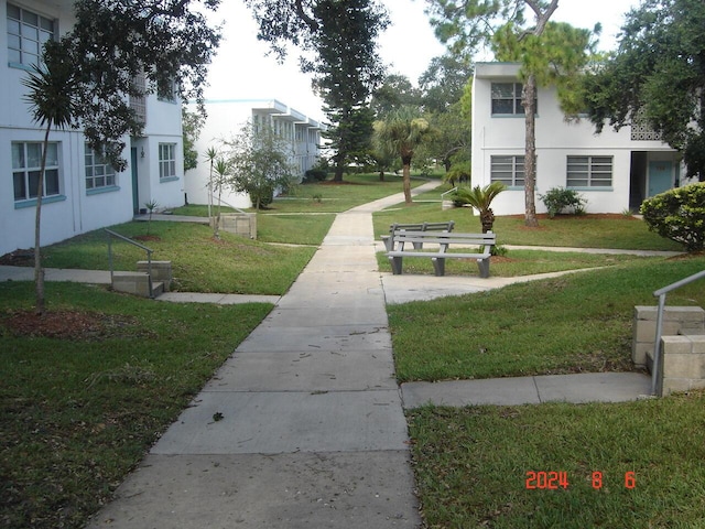 view of community featuring a yard