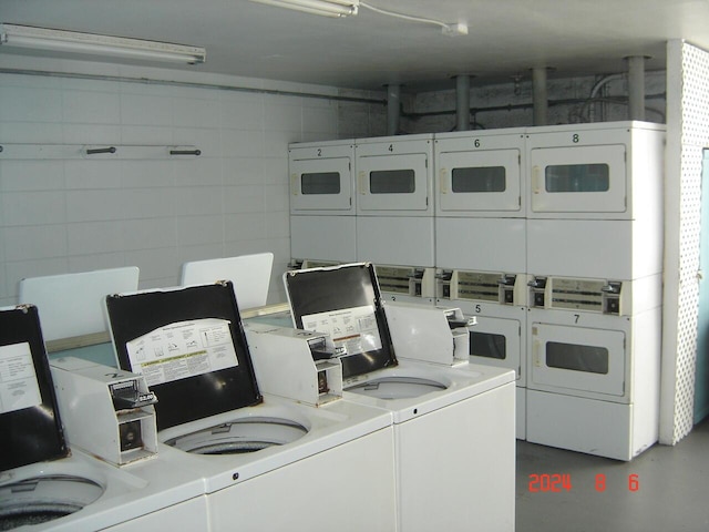 shared laundry area featuring stacked washer / dryer and independent washer and dryer