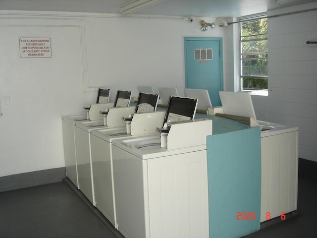 common laundry area featuring washer and clothes dryer