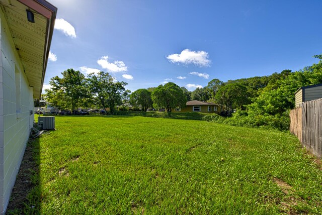 view of yard with central air condition unit