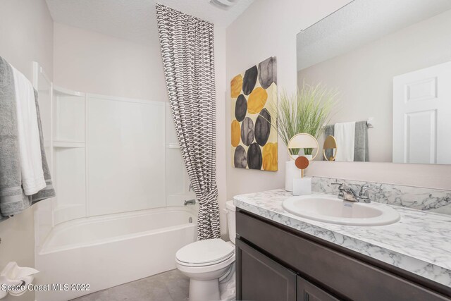 full bathroom featuring vanity, shower / bath combination, tile patterned flooring, and toilet