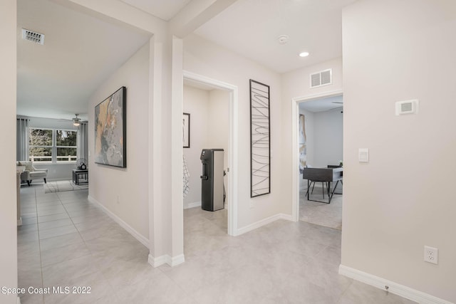 hallway featuring light tile patterned floors