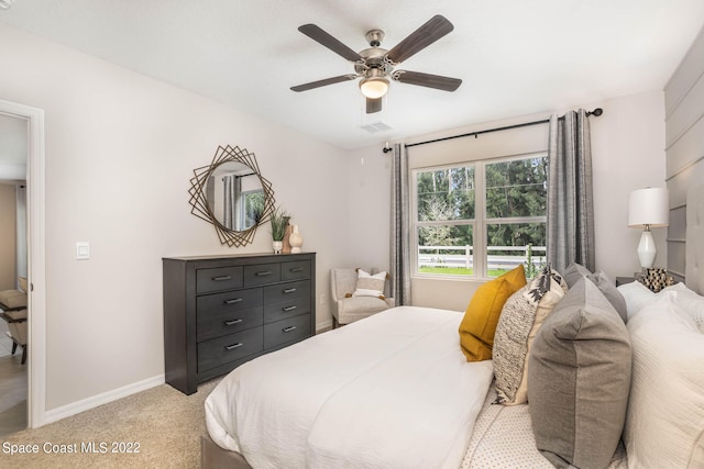 carpeted bedroom featuring ceiling fan