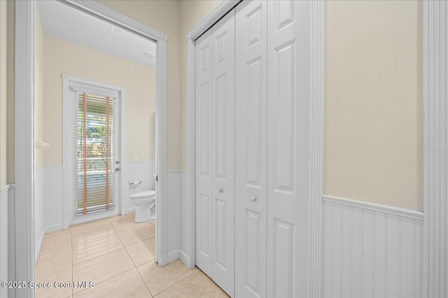 hallway featuring light tile patterned flooring