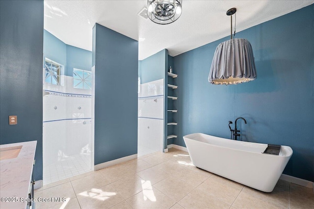 bathroom featuring tile patterned flooring, built in features, and a textured ceiling