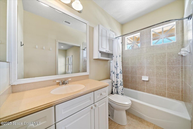 full bathroom featuring toilet, a textured ceiling, vanity, shower / bath combo with shower curtain, and tile patterned flooring