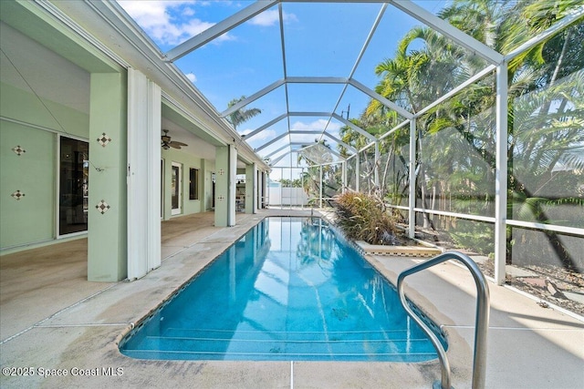 view of pool with a lanai and a patio area