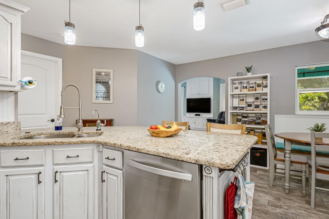 kitchen featuring white cabinetry, dishwasher, sink, and decorative light fixtures